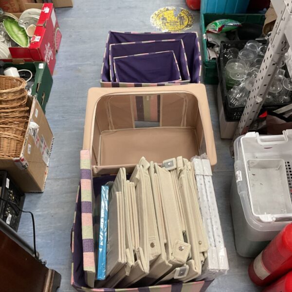 Selection of colourful collapsible storage boxes for home organisation.