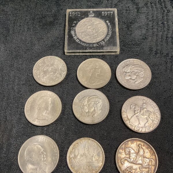 Commemorative coin collection featuring a silver Canadian dollar and British Crown.