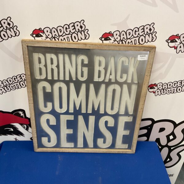 Vintage "Bring Back Common Sense" wall plaque for rustic home decor.