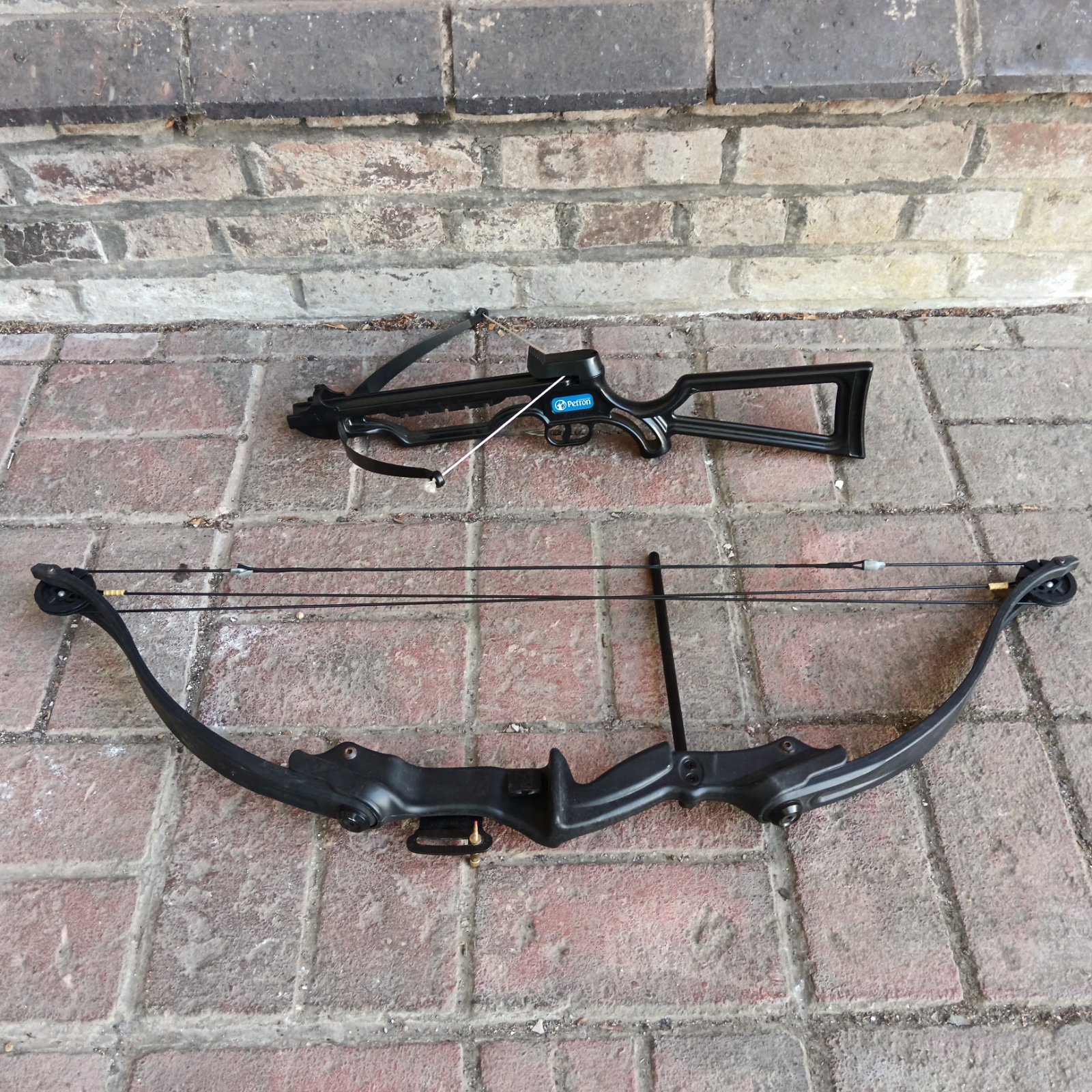 Compound bow and petron crossbow lot for archery enthusiasts.