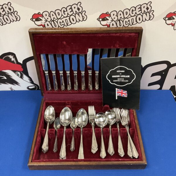 Vintage Cooper Ludlam cutlery set displayed in its original case.