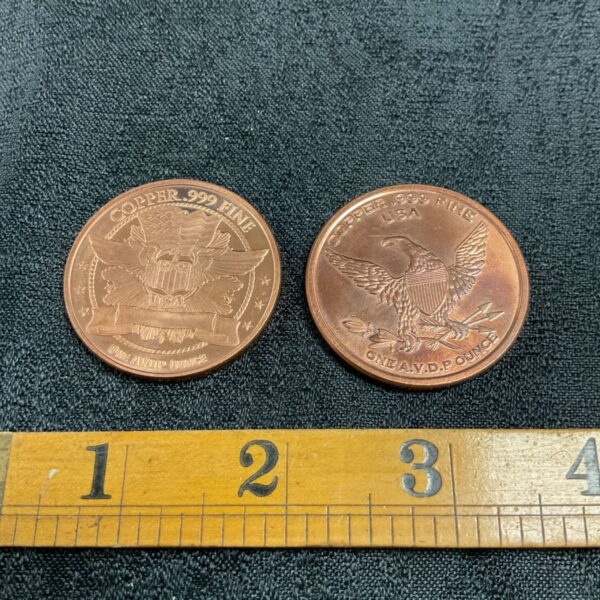 Close-up of copper bullion coin obverse with eagle design.