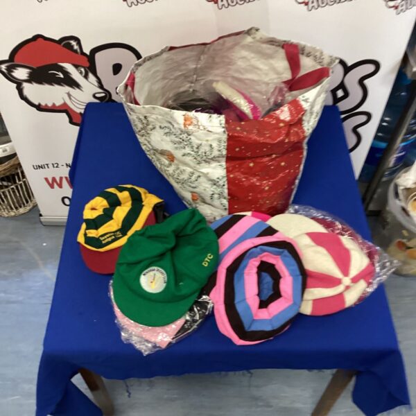 Lot of vintage and used cricket hats including Wingham Cricket Club.