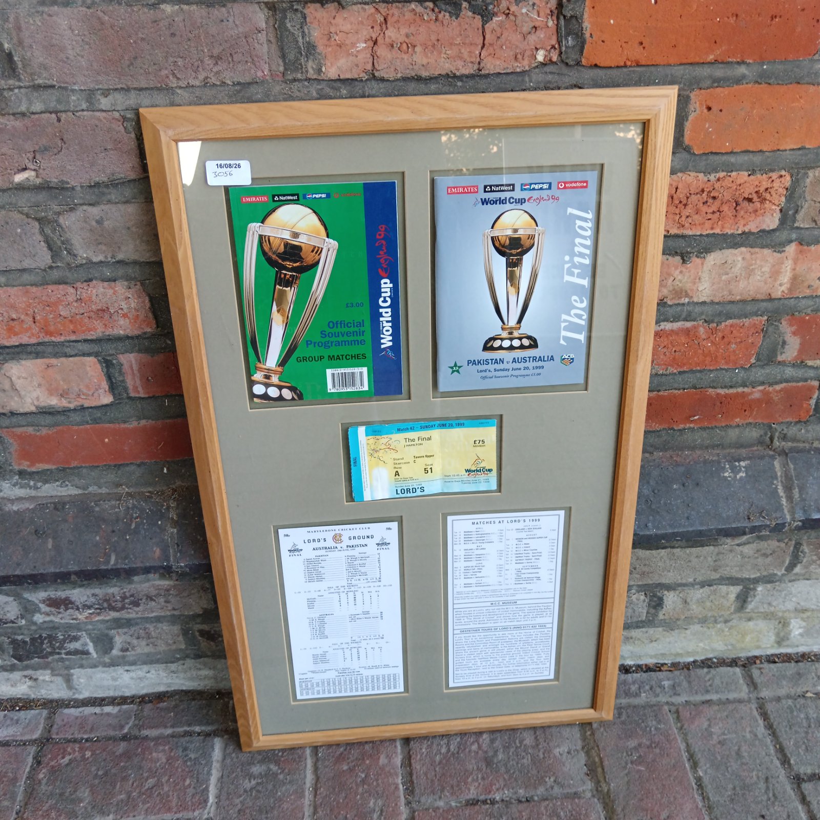 Framed 1999 Cricket World Cup Final memorabilia collection.