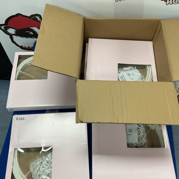 Box of plastic curtain coil tracks for window treatments.