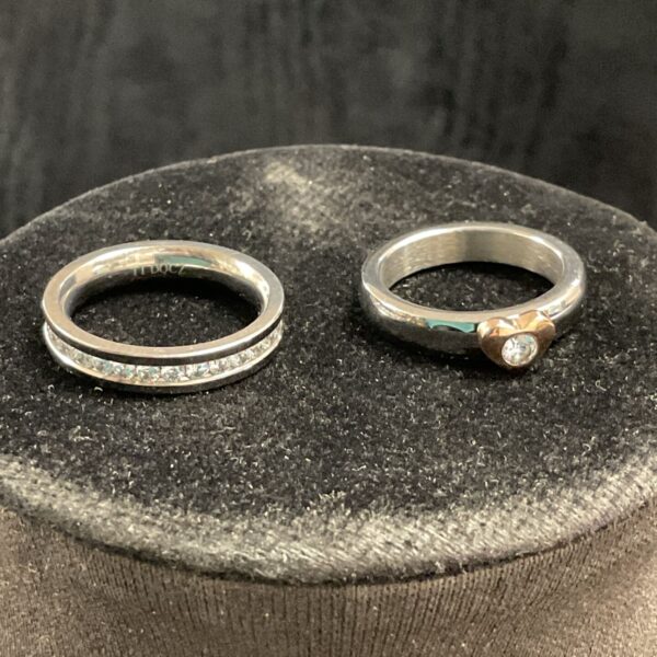 Stainless steel ring set with sparkling cubic zirconia stones.