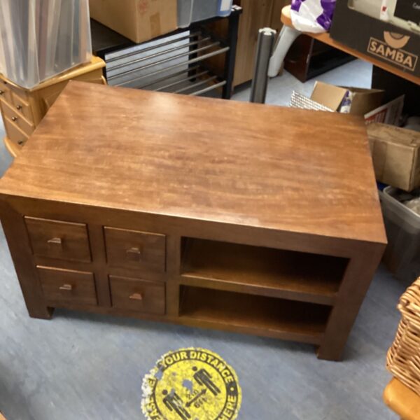 Dark oak media cabinet with DVD drawers for home entertainment.