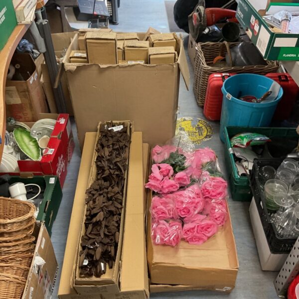 Job lot of mixed decorative flowers in pink and cream.