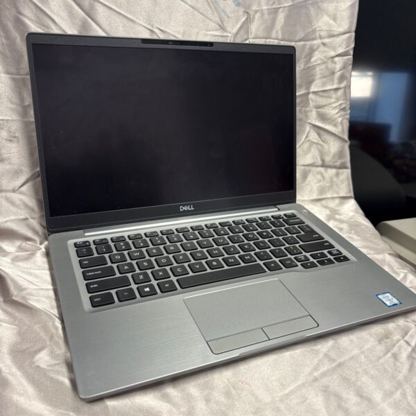 Black Dell laptop with keyboard visible, suitable for computing tasks.