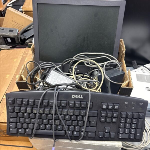 Dell computer monitor with keyboard and speakers in a bundle.