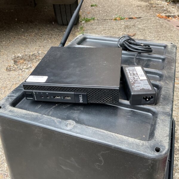 Dell Optiplex mini PC front view with antenna.