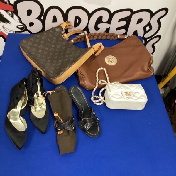 Designer handbags and heels lot including Chanel and Vuitton styles.