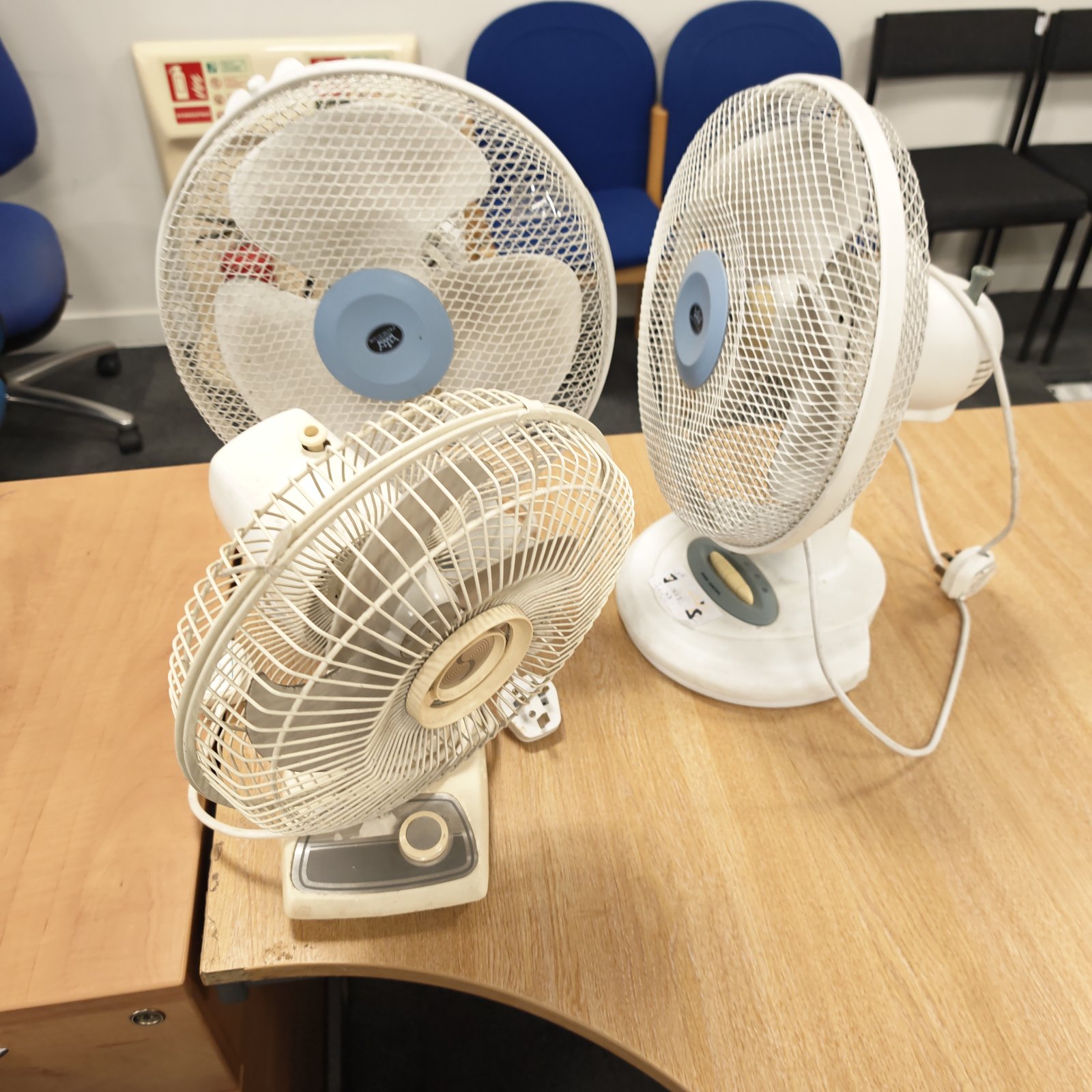 Lot of three vintage desk fans for auction.