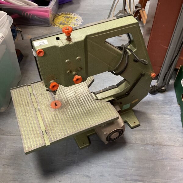 Vintage DeWalt DW100 bandsaw, a classic woodworking tool.