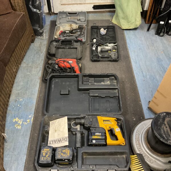 Open Dewalt power tool kit with drill and impact driver.