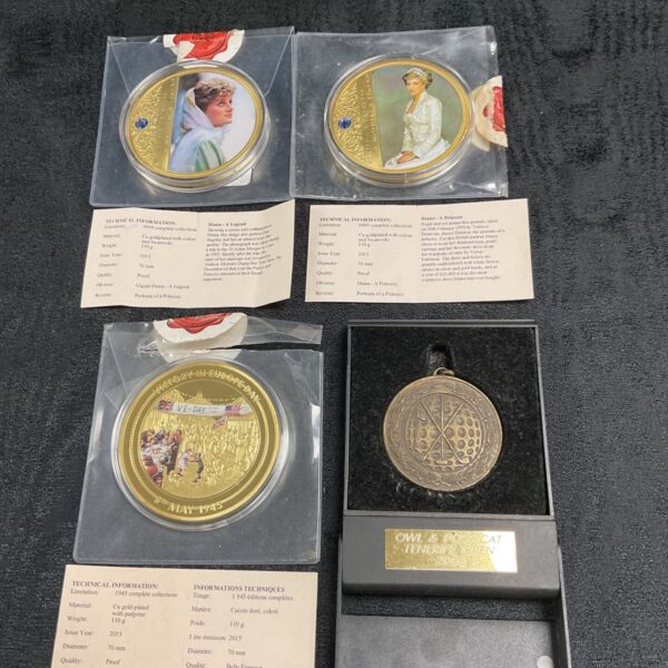 Gold plated commemorative coins featuring Princess Diana and VE Day.