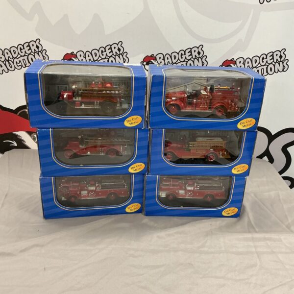 Lot of six American Mint diecast fire trucks, collectible models.