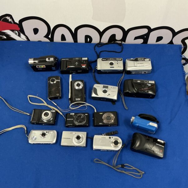 Assorted digital cameras in a lot, including Nikon, Sony, and Olympus brands.