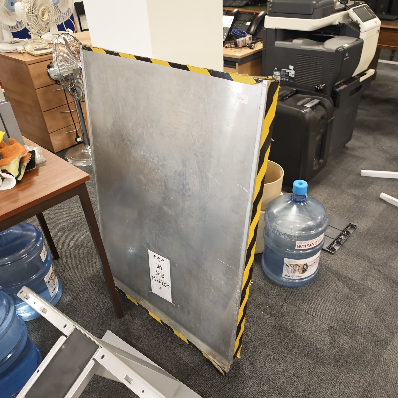 Portable disability ramp for accessibility, shown in a room.