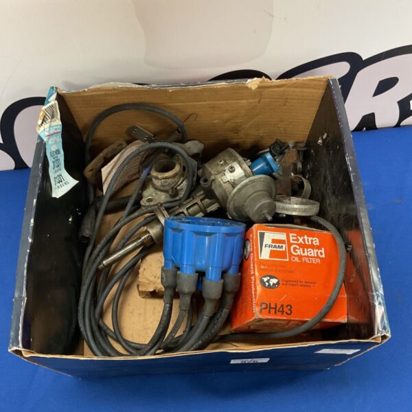 Vintage distributor cap with blue ignition wires, PH3 model.