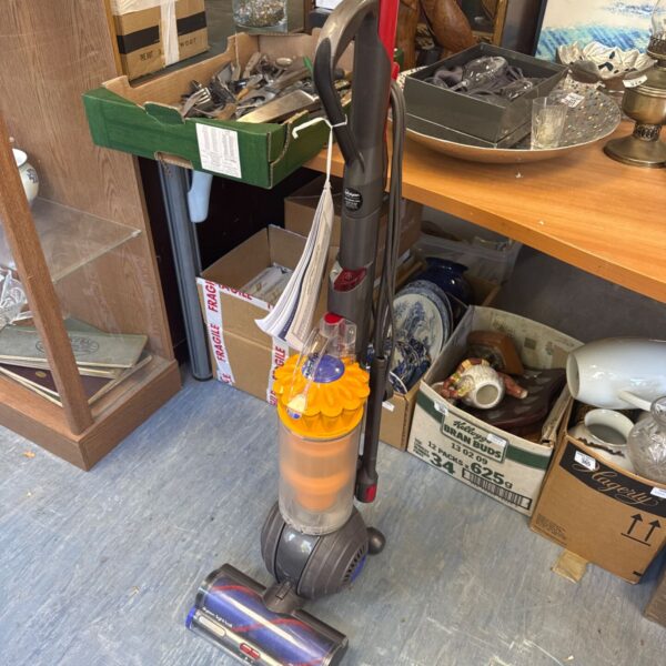 Dyson Light Ball Multi Floor hoover with instruction manual in auction setting.