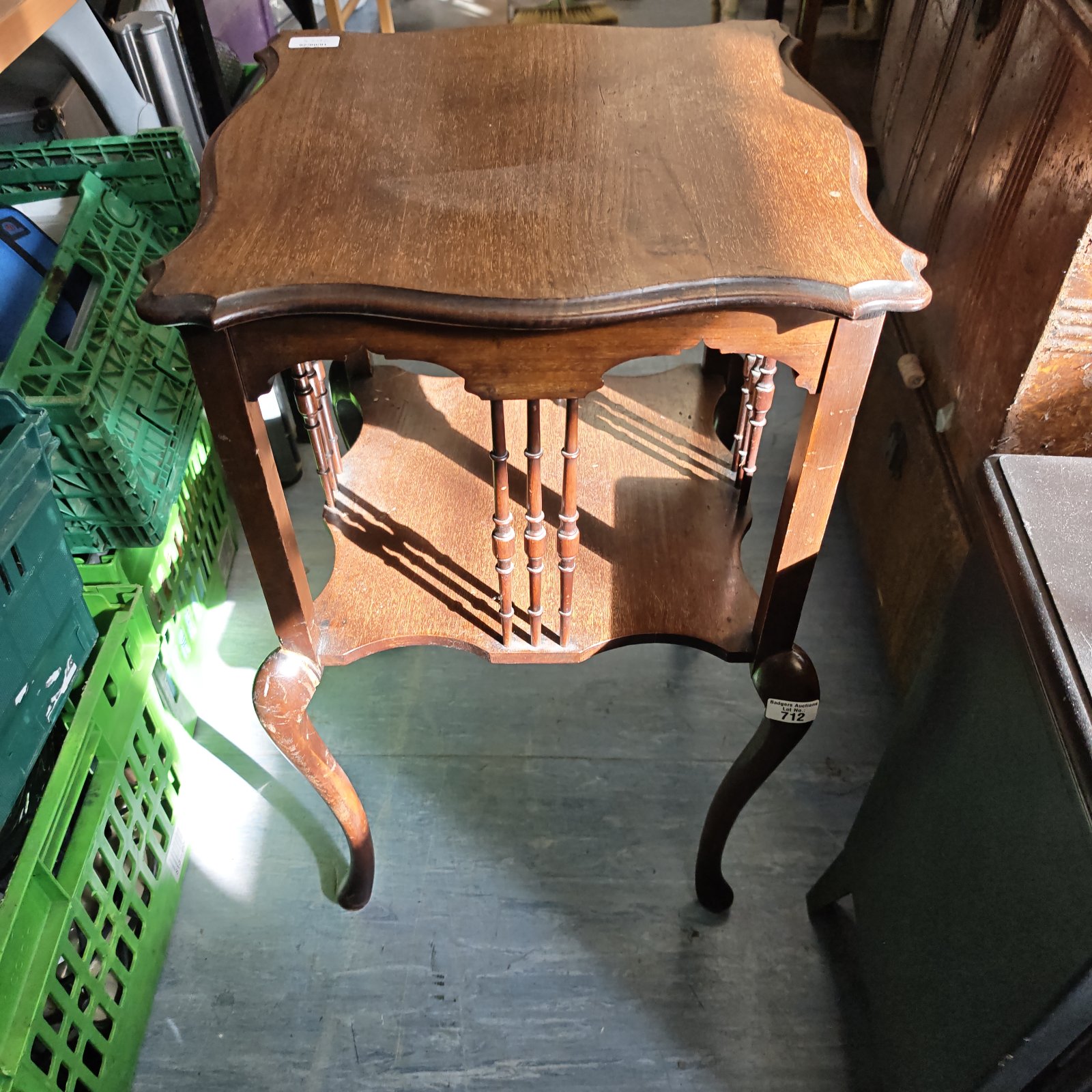 Vintage Edwardian two-tier occasional table with curved legs.