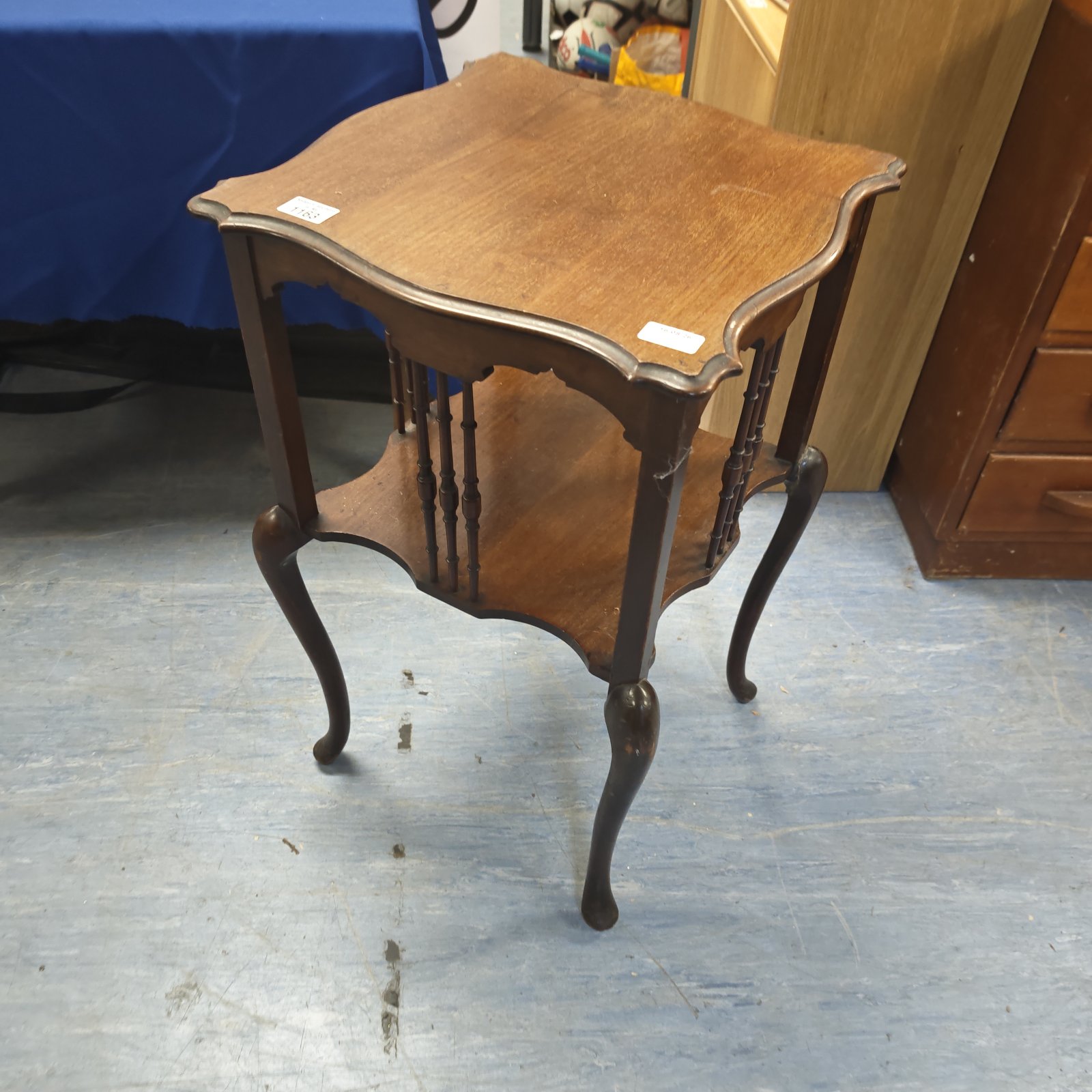 Vintage Edwardian side table with two tiers and scalloped top.