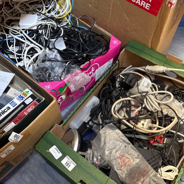 Mixed lot of electrical cables and components in cardboard boxes.