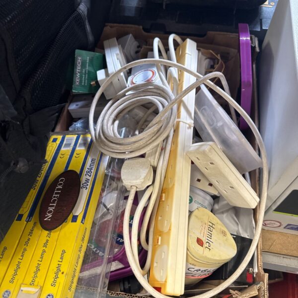 Tray of mixed electrical items including timers and extension leads.