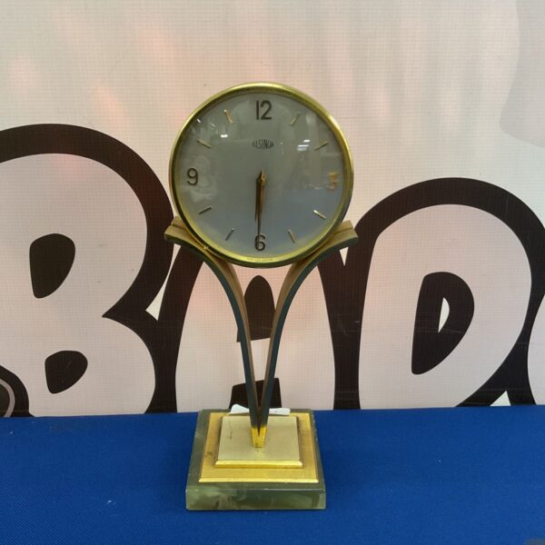 Vintage Elsinor mantle clock with brass supports and onyx base.