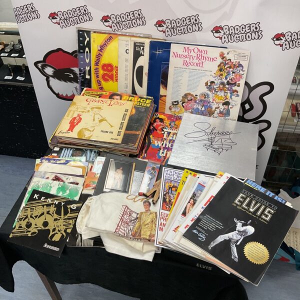 Elvis Presley vinyl records and memorabilia collection for sale.