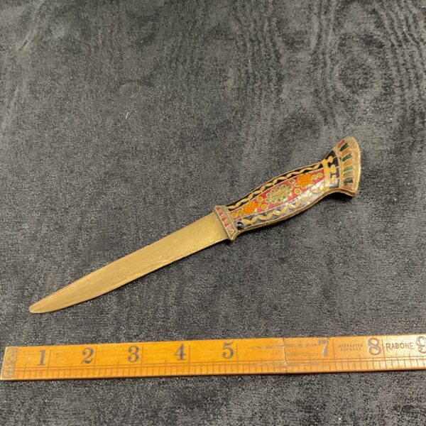 Vintage enamelled paper knife with brass blade and colourful handle.