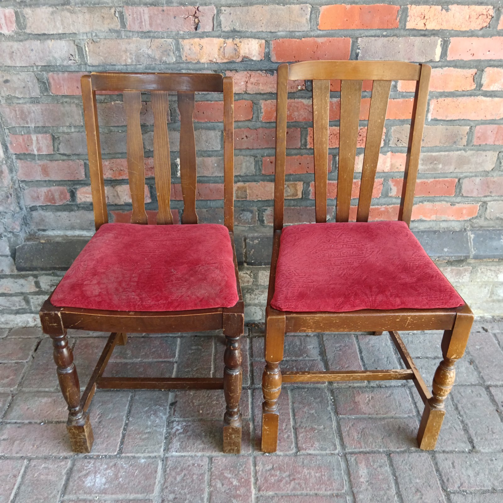 Vintage Ercol dining chairs with red seats, mid century modern style.