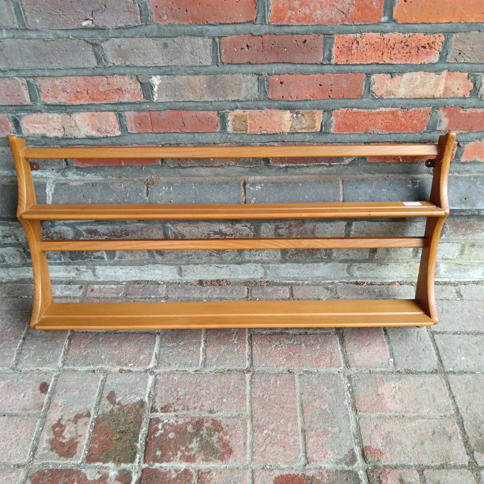 Vintage Ercol gold label plate rack shelving unit.