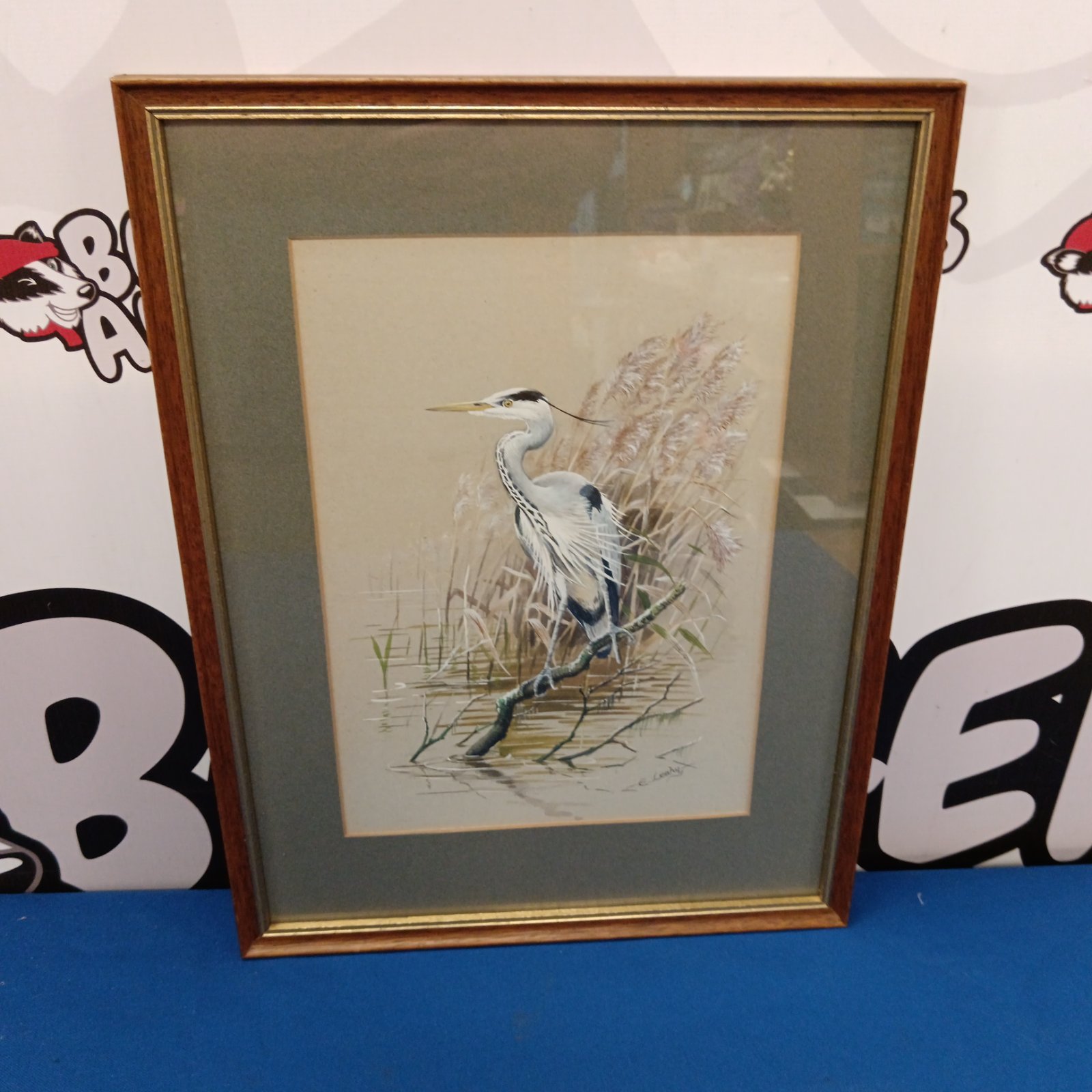 Framed watercolour painting of a grey heron by Ernest Leahy.