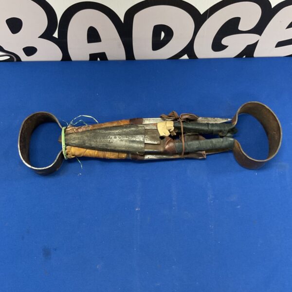 Vintage ethnographic double blade tool with organic handle.