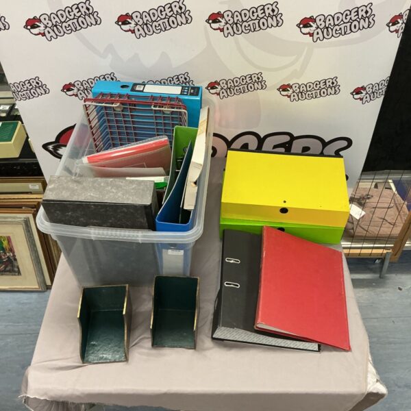Assorted filing folders and box files for document organisation.