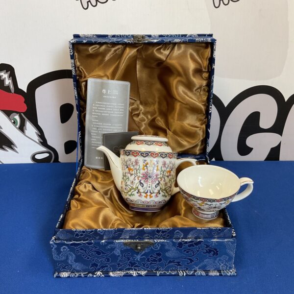 Elegant fine bone china teapot set displayed in a protective case.