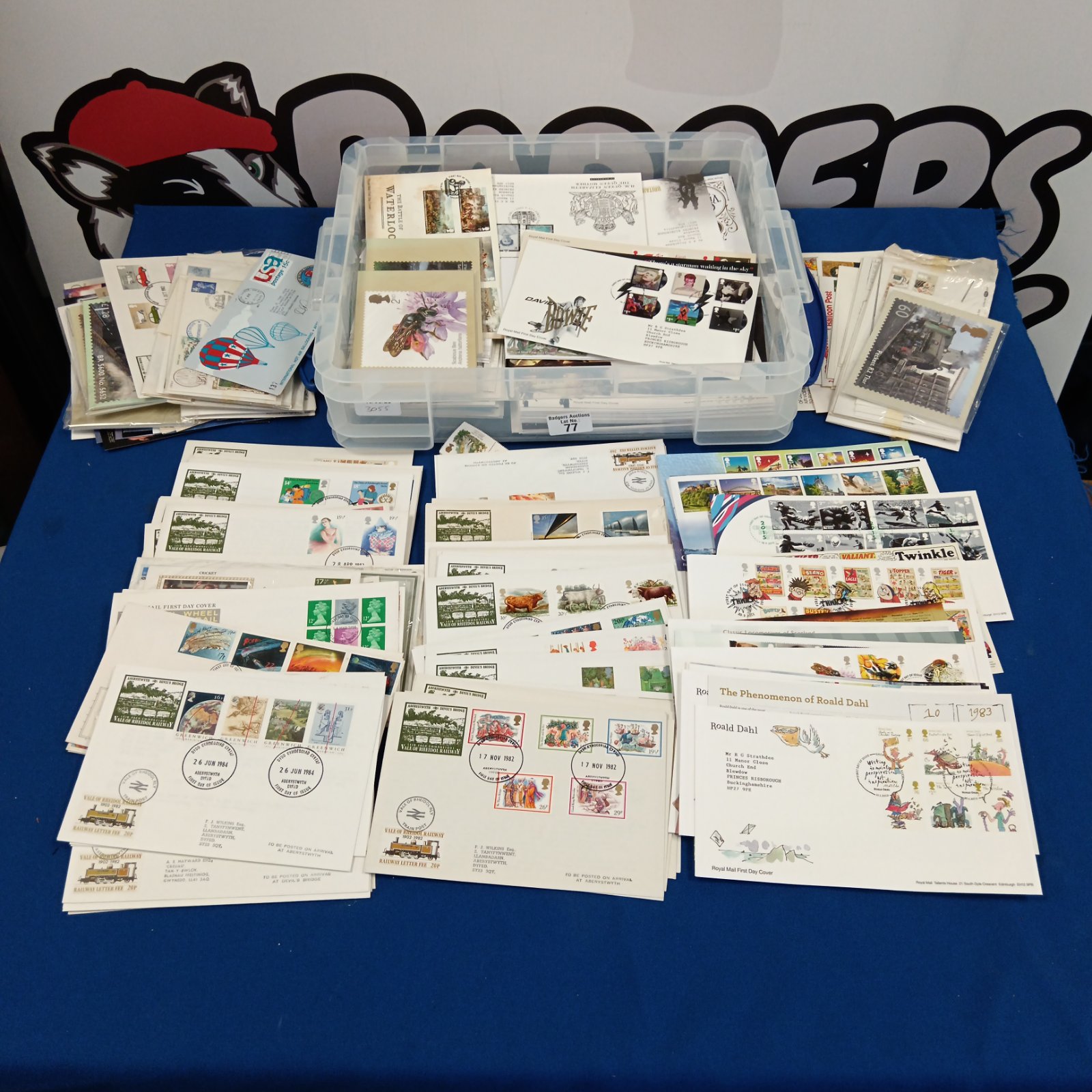 Large collection of first day stamp covers and postcards in a box.