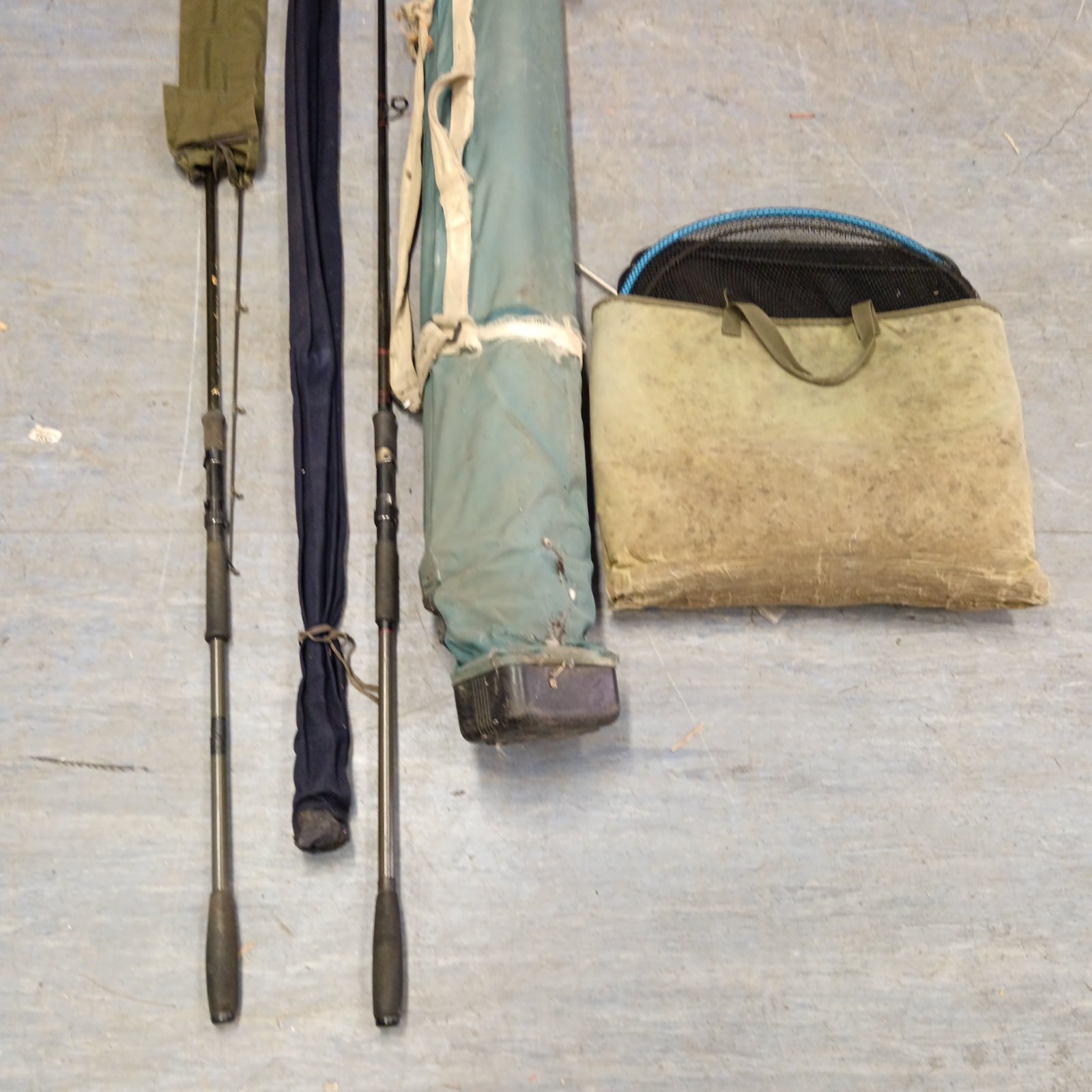 Fishing rod bag with rods and keepnets, angling equipment.