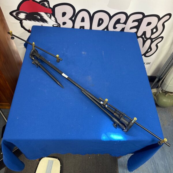 Adjustable fishing rod pod with metal bars for secure rod support.