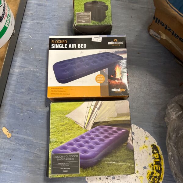 Flocked single air bed with electric battery pump in packaging.