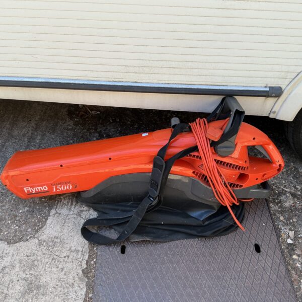 Used Flymo 1500 garden vac with power cable visible.