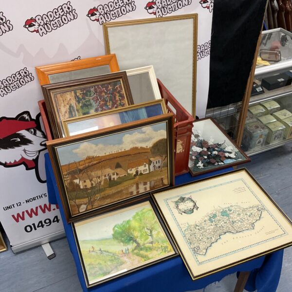 Framed artworks including Rob Morden Sussex map and oil painting of cottages.