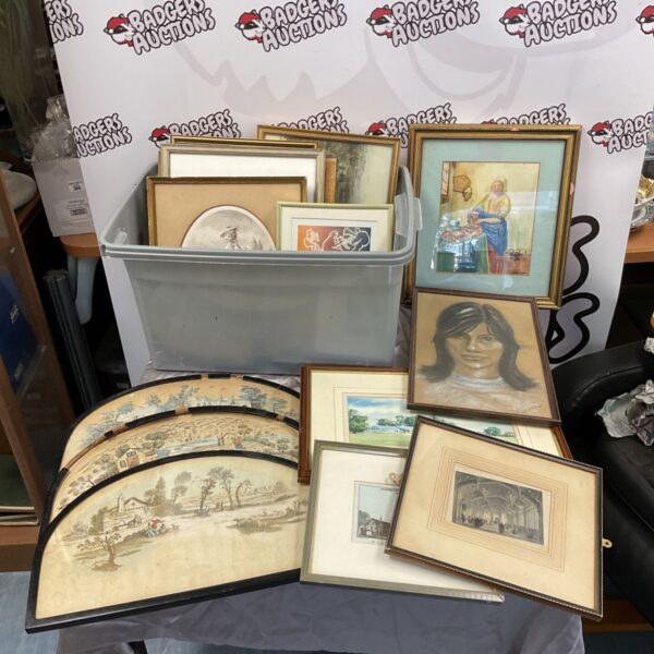 Collection of framed prints and engravings at auction.