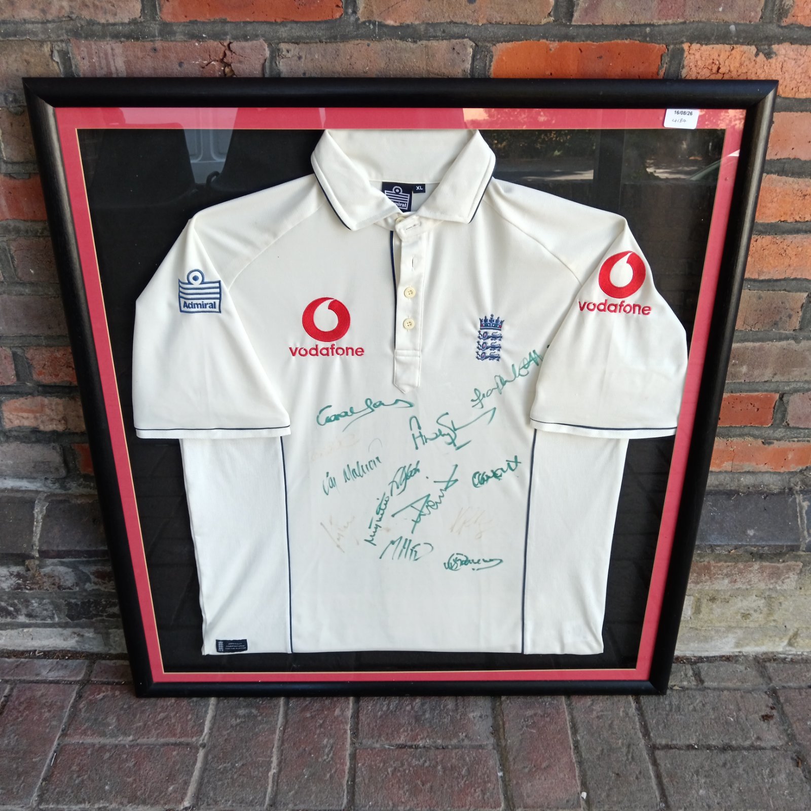 Framed signed England cricket shirt with Vodafone sponsorship.