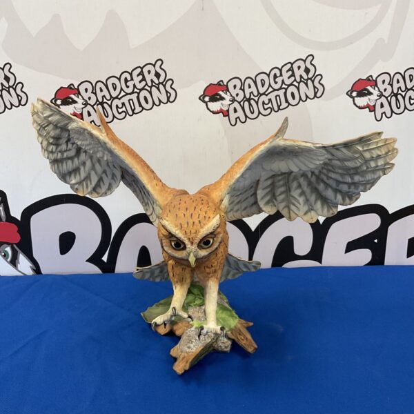 Detailed Franklin Mint screech owl sculpture on a branch.