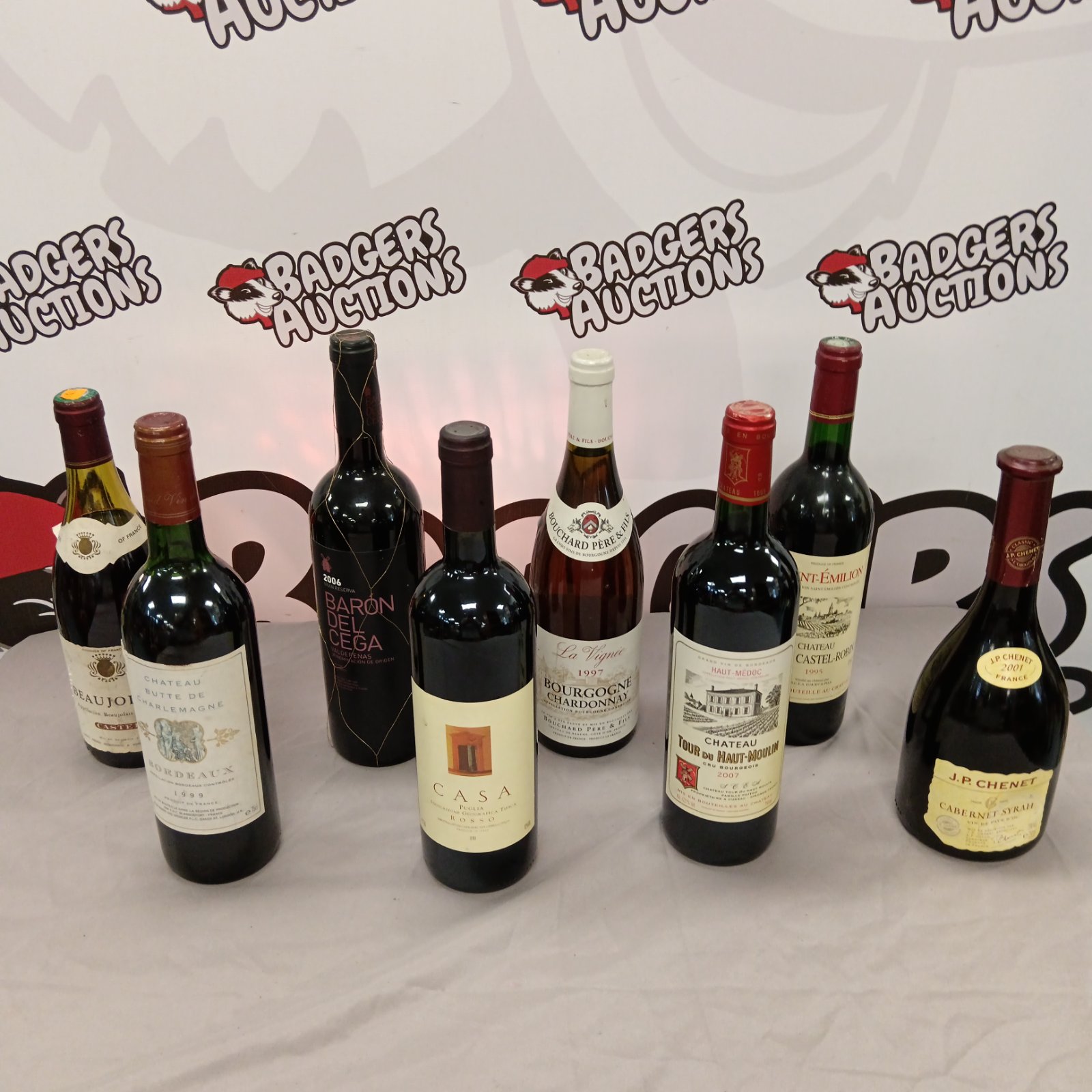 Collection of eight French wine bottles, including Burgundy Chardonnay.