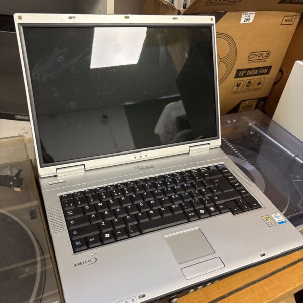 Vintage Fujitsu Siemens Amilo L731 laptop in silver.