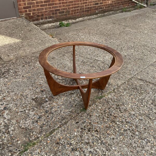 Vintage G-Plan coffee table with teak top and tripod legs.